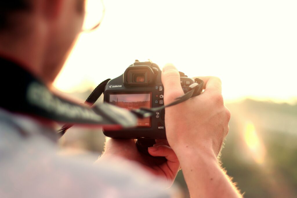 Man holding a camera, ready to take a picture